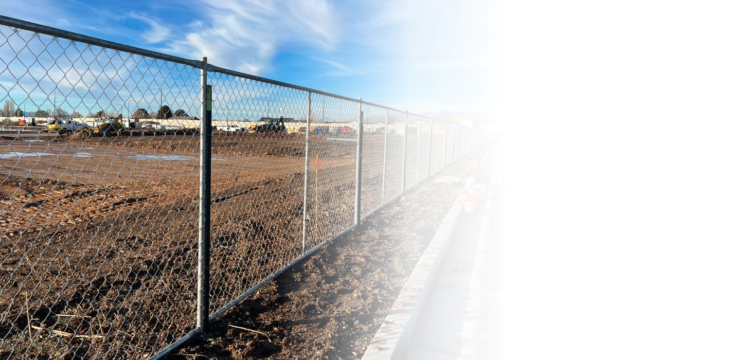 commercial construction with chain link fence installed